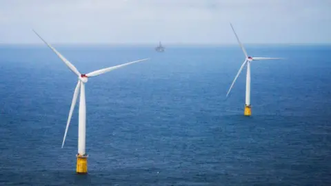 OLE BERG-RUSTEN/NTB/AFP Two wind turbines turn in the North Sea off the coast of Bergen in Norway