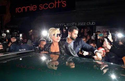 Getty images Lady Gaga is surrounded by fan and photographers while leaving Ronnie Scott jazz in London