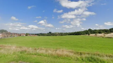 Google An image of Bentilee showing grass and houses in the distance