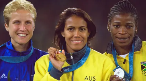 Getty Images Katharine Merry, Cathy Freeman and Lorraine Graham with their medals at the Olympic Games in Sydney in 2000