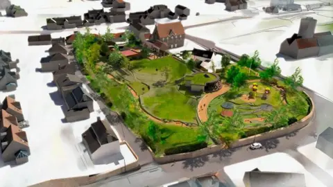 BDK Architects A vision of the park with trees and grass in the design and other structures. Various houses on the outside of the park and roads. 