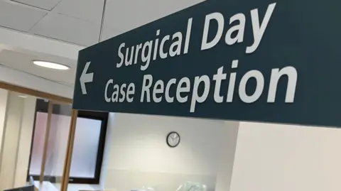 Surgical day case reception sign at East Midlands NHS Planned Care Centre at Leicester General Hospital