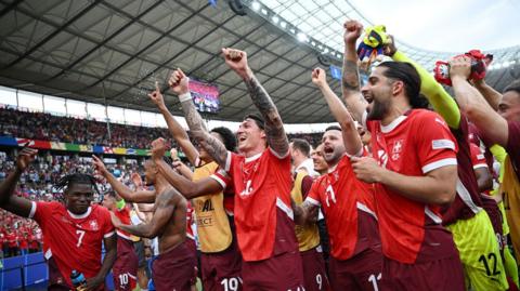 Switzerland celebrate after their win over Italy to reach the quarter-finals of Euro 2024
