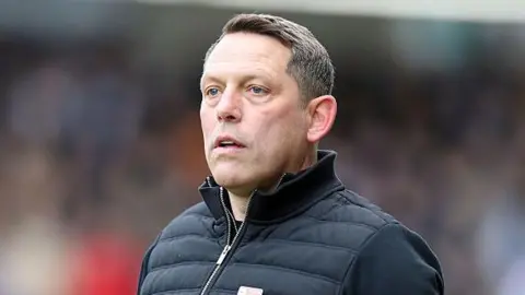 Leam Richardson looks on from the sidelines 