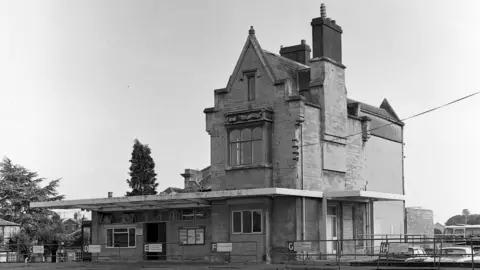 Old Ciren Black and white photo of the outside of the Old Station in Cirencester.