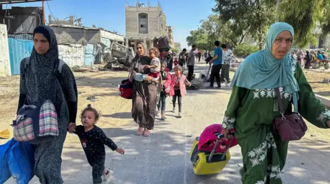 Reuters File photo showing Palestinian women and children fleeing the Jabalia area of northern Gaza on 23 October 2024