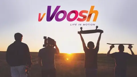 vVoosh A grab of lifestyle app vVoosh which has the tagline Life in Motion under the logo and is set against the backdrop of four skateboarders walking towards the sunset. 
