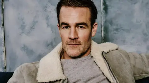 Getty Images James Van Der Beek pictured in 2020 wearing a grey jacket with a white fur collar