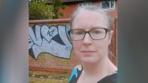 Rachel Hobbs-Harding selfie in front of the graffiti