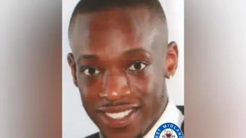 A man is looking at the camera. 