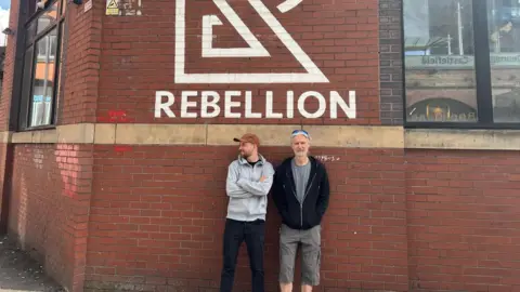 Rebellion Alex Kostyakov (left) with co-owner Jason outside Rebellion