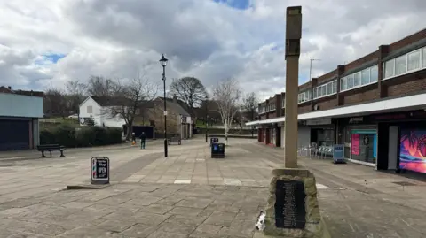 BBC/Sinead Thompson Woodhouse Market Square, a small precinct with shops and a war memorial