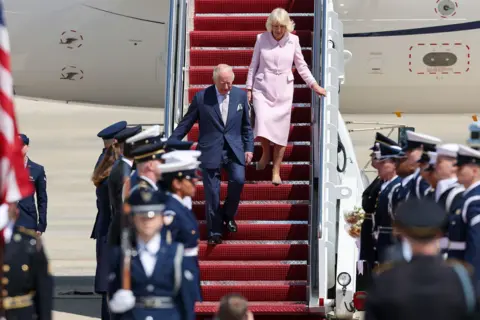 Getty Images King Charles III and Queen Camila disembark their plane as they arrive on day one of their State Visit to the United States, on April 27, 2026 at Joint Base Andrews, Maryland.