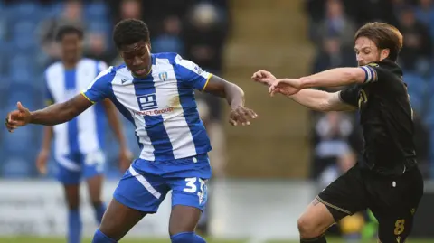 Colchester's Micah Mbick playing against Gillingham