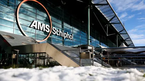 Snow lies on ground outside Schiphol Airport in Amsterdam 