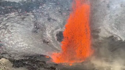 Volcano erupting and lava soaring high