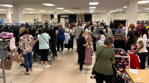 Shoppers at the £1school uniform sale