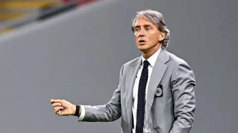 Roberto Mancini on the sidelines while managing Al-Sadd in Qatar
