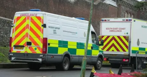 Eddie Mitchell Two ambulance vehicles, including one chemical support unit, parked outside the walls of Lewes Prison on Thursday