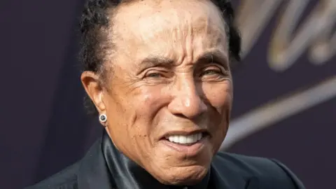 Smokey Robinson smiling on the red carpet at the premiere of Michael at the Dolby Theater in Hollywood, California, on 20 April 2026