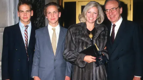 Ron Galella Collection via Getty Images Anna Murdoch-Mann with her ex-husband Rupert Murdoch and two sons James and Lachlan Murdoch.