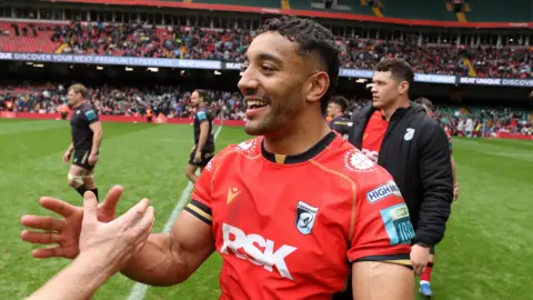 Gabriel Hamer-Webb high fives a team mate at the Principality Stadium