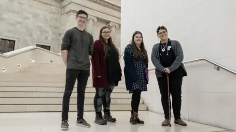 Four teenagers on the steps of the British Museum