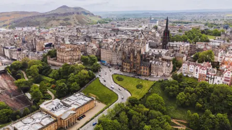 Getty Images An aerial view of Edinburgh city centre, including parts of Waverley Station and Scottish National Gallery.