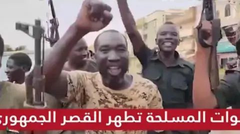 Sudan TV A screengrab from Sudanese TV showing jubilant soldiers.