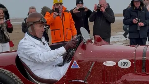 BBC RAF fighter pilot Wing Cdr Andy Green, driving the red Sunbeam Tiger