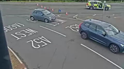 Nottingham Travelwise Cones in a road with a police vehicle