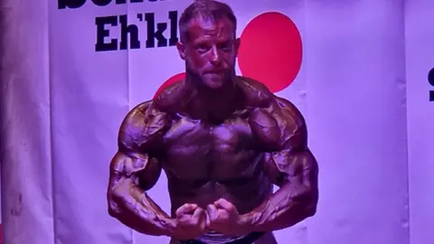 T Rosiek Tim Rosiek flexing his muscles 