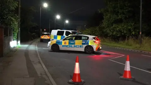 Three police vehicles at scene of accident on A61