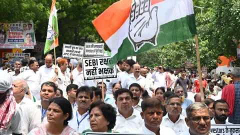 Getty Images Congress party worker and supporters the Congress party on Thursday protested at Jantar Mantar on the issues of the demand for a JPC probe into the Hindenburg case, the removal of the SEBI chief, unemployment and corruption during the Dharna/Demonstration against unemployment, on August 22, 2024 in New Delhi India.