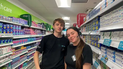 BBC News Two supervisors inside the Saver store in Cardiff