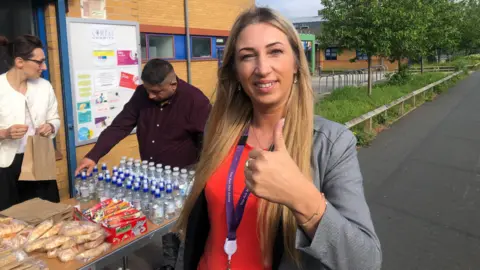 John Devine/BBC Raimonda giving a thumbs-up