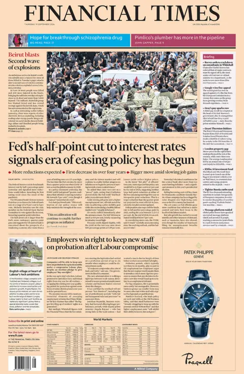 The Financial Times header  reads "Fed's half-point chopped  to involvement  rates signals epoch  of easing argumentation  has begun". 