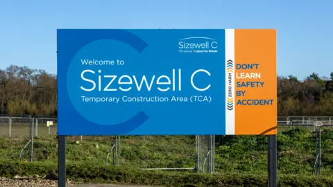 Large blue and orange sign saying 'Sizewell C temporary construction area'