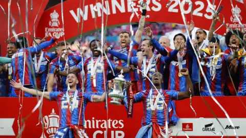 EPA Players of Crystal Palace celebrate with the trophy after winning the FA Cup Final.