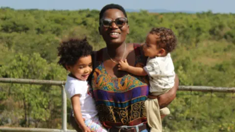 NHS Blood and Transplant Princess Green with her two children