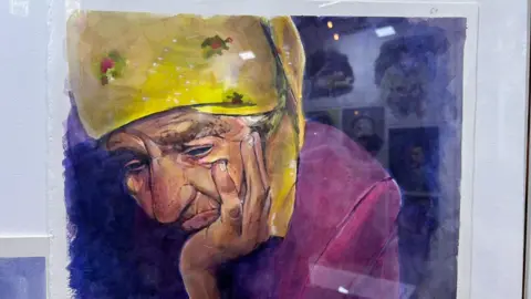 Louise Pasterfield A painting of a woman with her head in her hand and wearing a yellow scarf around her head. She looks downcast. 