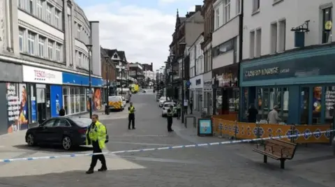An image of a police cordon in a street in Derby.