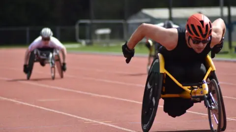 Handout image of Liam doing sports now in a wheelchair