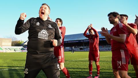 Manager Neil Gibson celebrates with his Connah's Quay Nomads team after winning the Welsh Cup final