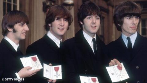 The members of The Beatles, Ringo Starr, John Lennon, Paul McCartney and George Harrison, outside Buckingham Palace, London, after receiving their MBEs.
