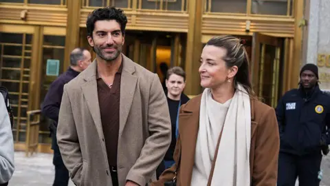 Actor Justin Baldoni and his wife, Emily, appear outside of a New York courthouse 
