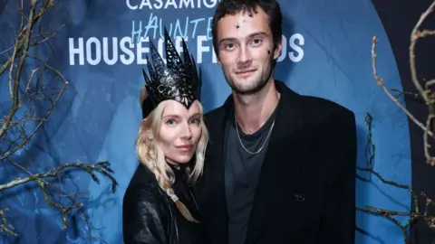 Getty Images Sienna Miller and Oli Green attend Casamigos Tequila: The 2nd Haunted House of Friends' Halloween Party at Jack Solomons on October 31, 2024 in London, England