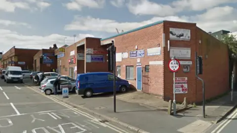 Google A Streetview image of Great Central Street, which has a row of red-brick single-storey buildings to the right.