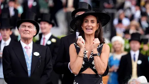 PA A woman cheers on her horse on the first day of Royal Ascot.