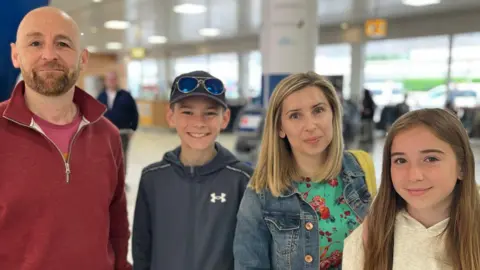 The Hellis family of four at Glasgow Airport